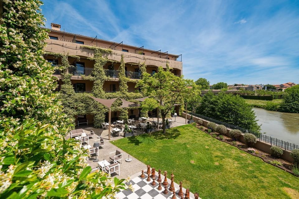 Welcome to Carcassonne — the terrace garden overlooks the Aude River, 100 metres from the UNESCO medieval city.