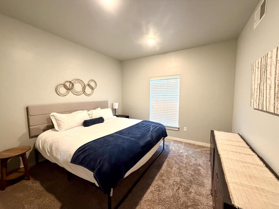 Spacious bedroom featuring a king bed 