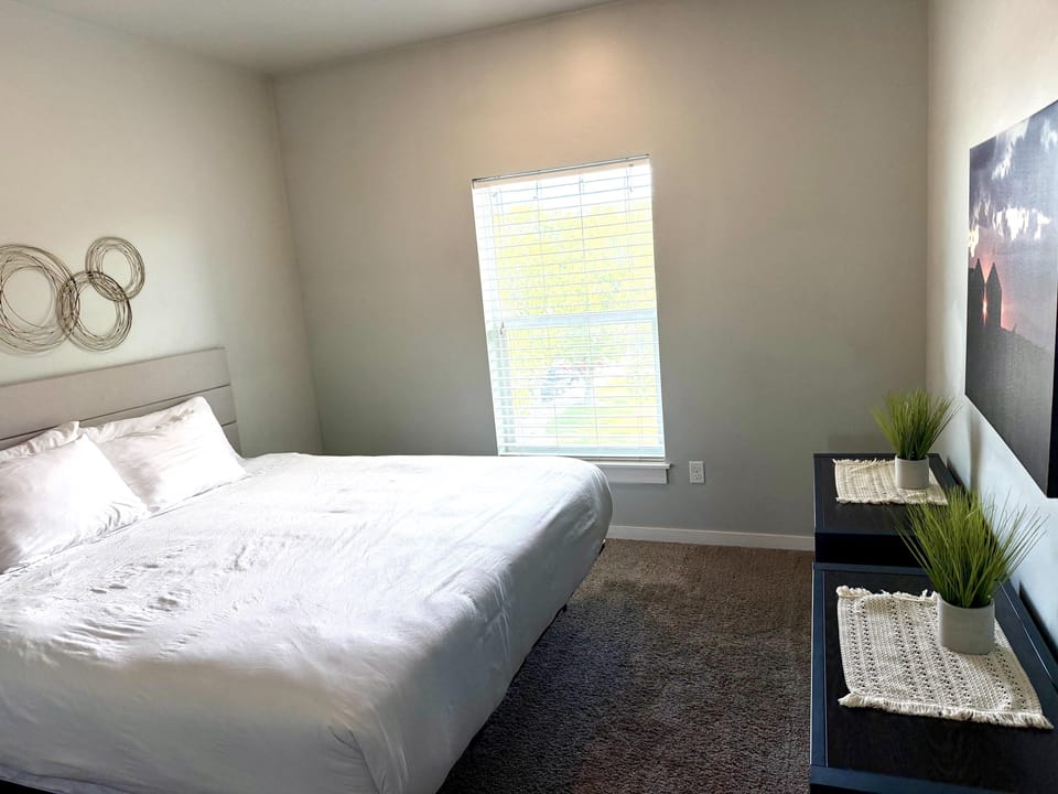 Spacious bedroom featuring a king bed 