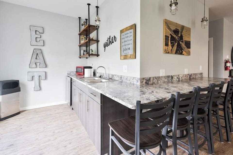 Enjoy the convenience of a kitchenette in the game room, complete with the essentials for food, drinks, and entertaining