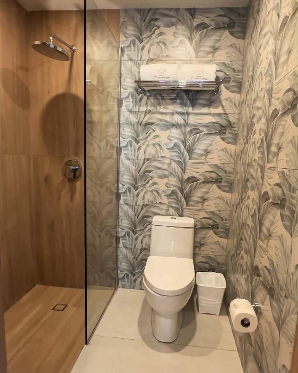 Standard Single Room, Garden View | Bathroom | Shower, rainfall showerhead, towels, soap