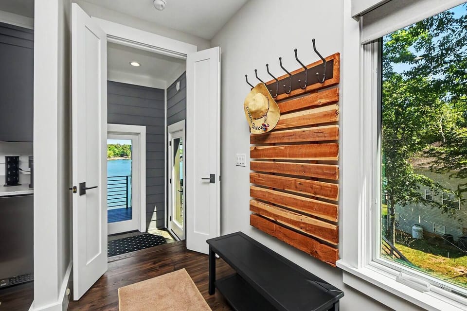 Welcoming private entryway directly across from private lake view balcony access.