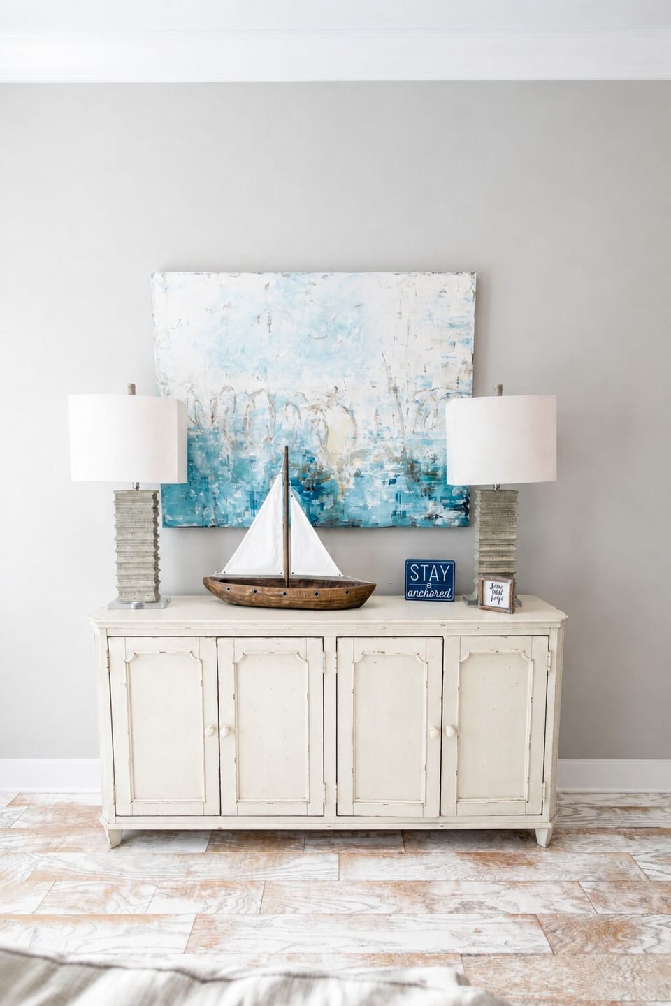 Coastal-inspired console with serene artwork and charming nautical decor