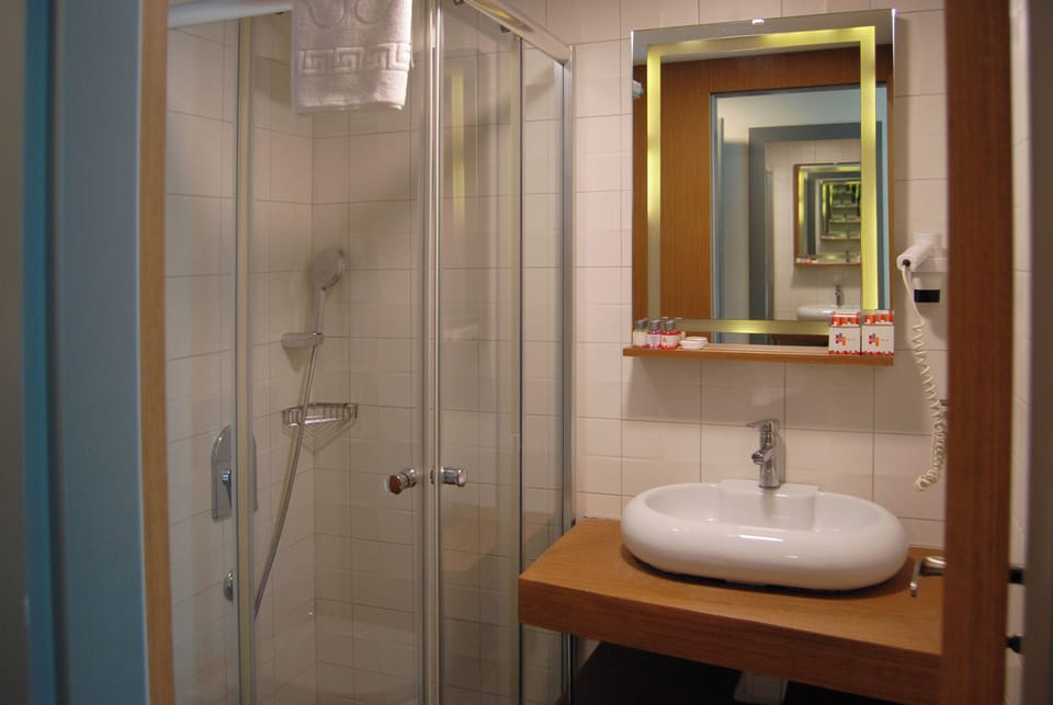 Shower, free toiletries, hair dryer, slippers