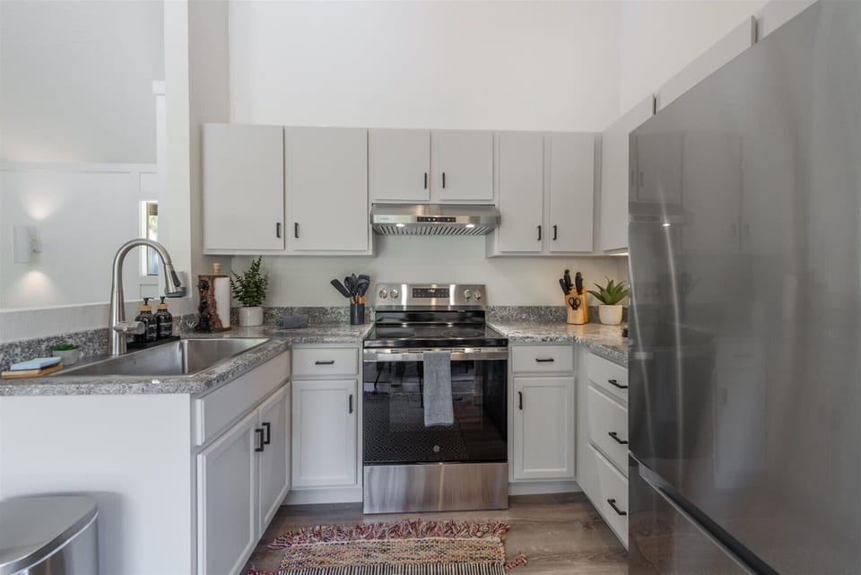 Step into your bright, fully equipped kitchen with granite countertops, stainless steel appliances, and everything you need to prepare delicious meals during your stay.