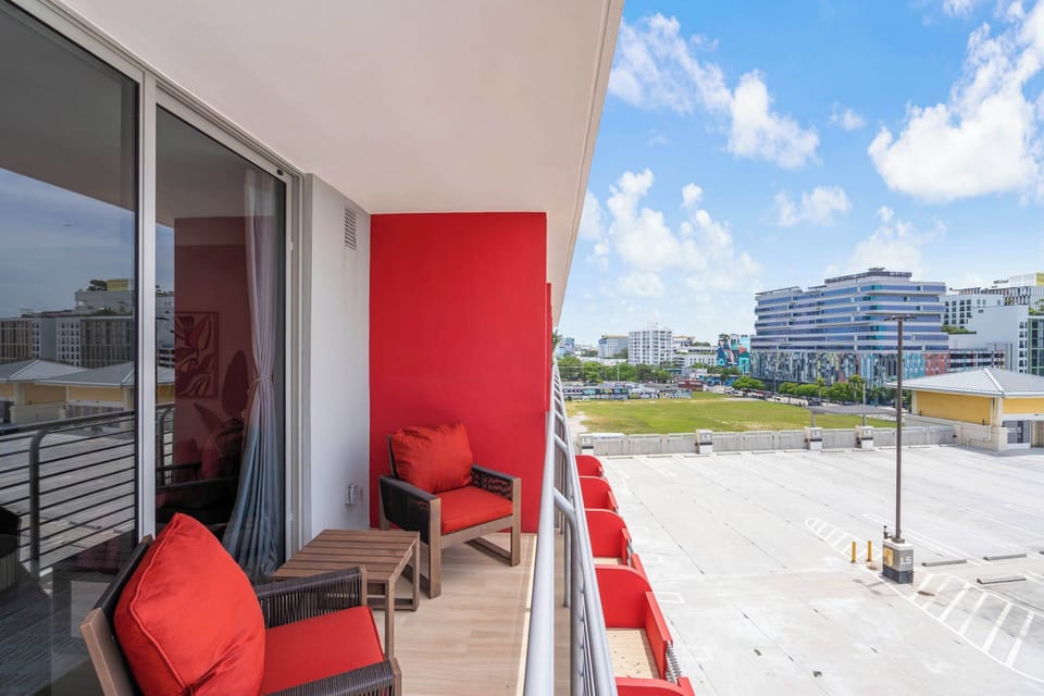 Step out onto your private balcony at The Standard Residences in Midtown Miami. Relax on the cozy outdoor seating and take in the sunny city views. The perfect spot for your morning coffee or evening wind-down.