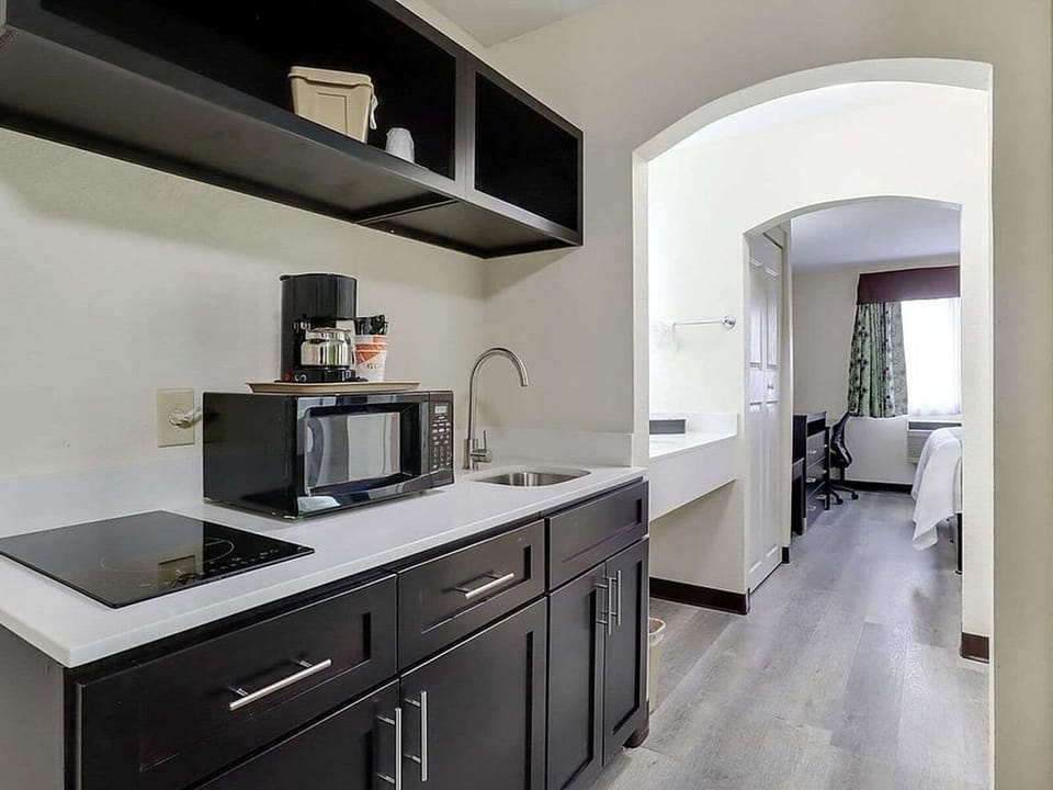 Suite, 2 Queen Beds, Non Smoking | In-room safe, desk, iron/ironing board, WiFi (free)