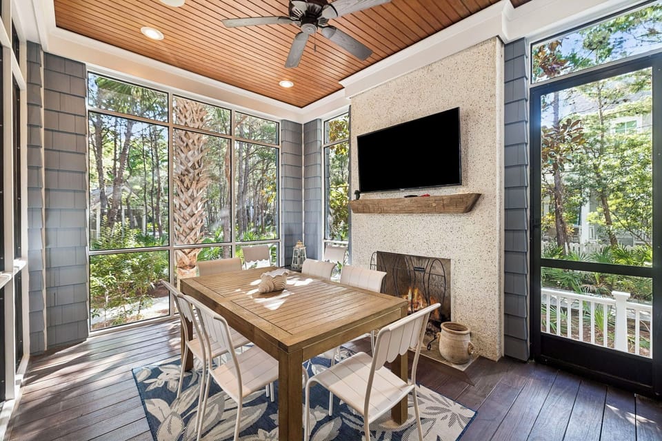 Sip your morning coffee on your private screened porch, surrounded by forest views and the warmth of a fireplace, perfect for relaxing any time of day.