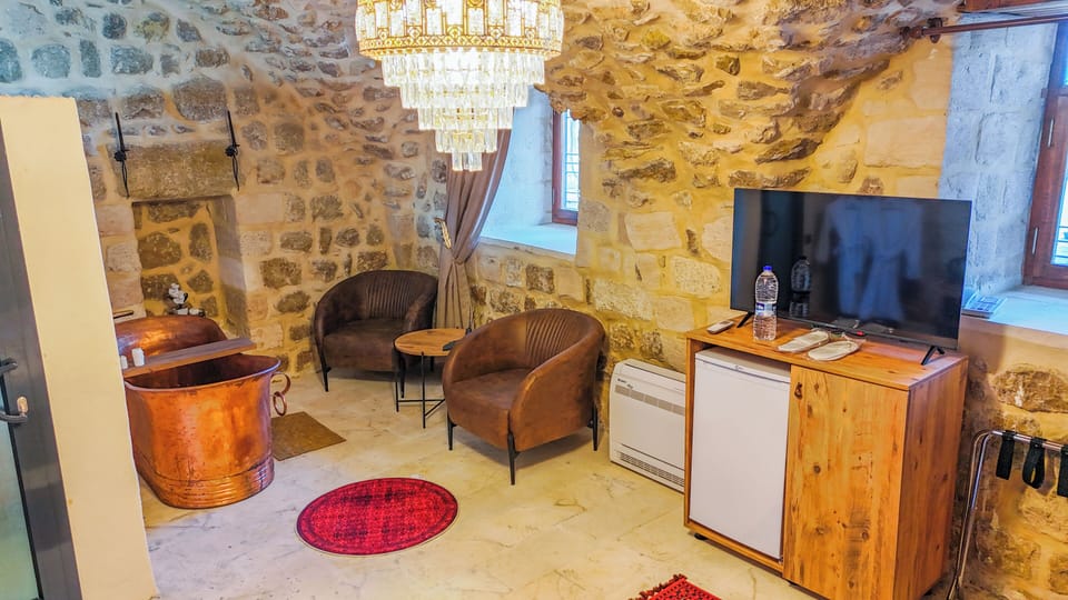 Deluxe Suite, Valley View | Living area | 52-inch LED TV with cable channels