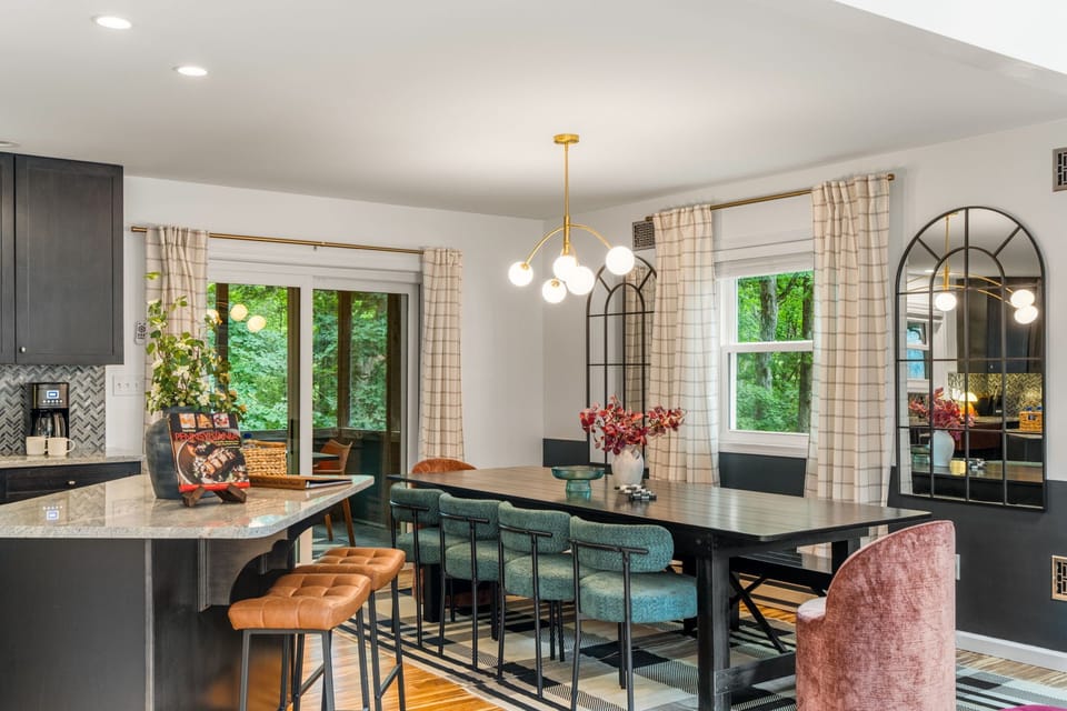 Bright, stylish dining space with garden views and seating for a crowd