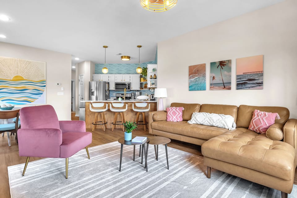 Relax and unwind in the bright, open living area and fully equipped kitchen.