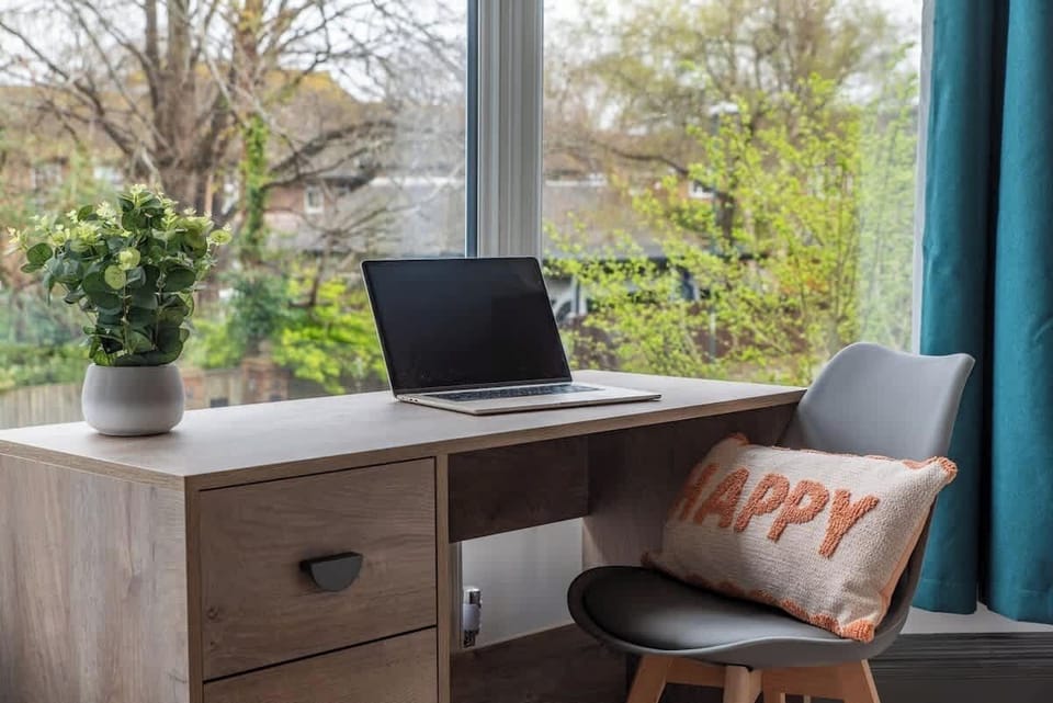 Dedicated workspace with a desk and comfortable seating — ideal for remote working or catching up on emails during your stay at Elm Lodge by Blue Puffin Stays Short Lets & Serviced Accommodatio