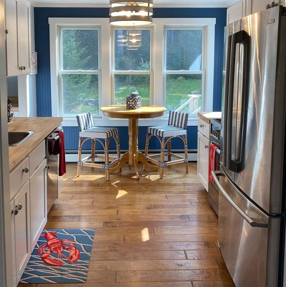 Full kitchen with bar height table and chairs