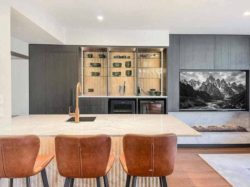 Cook, entertain, and gather around the stunning stone island in the fully equipped kitchen.
