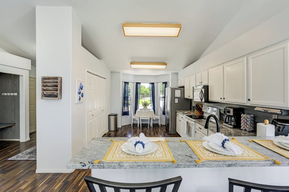 The fully equipped kitchen has everything needed for both weekend getaways and extended stays, including cookware, dinnerware, and a dual coffee maker to start your mornings right.