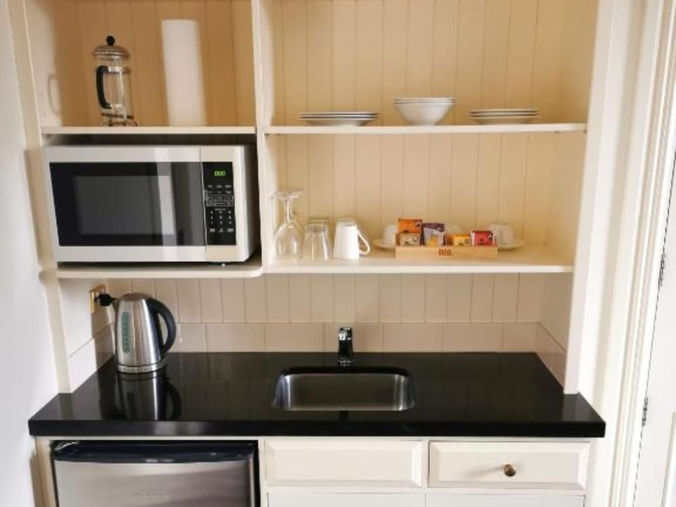 Mini-fridge, microwave, electric kettle, toaster