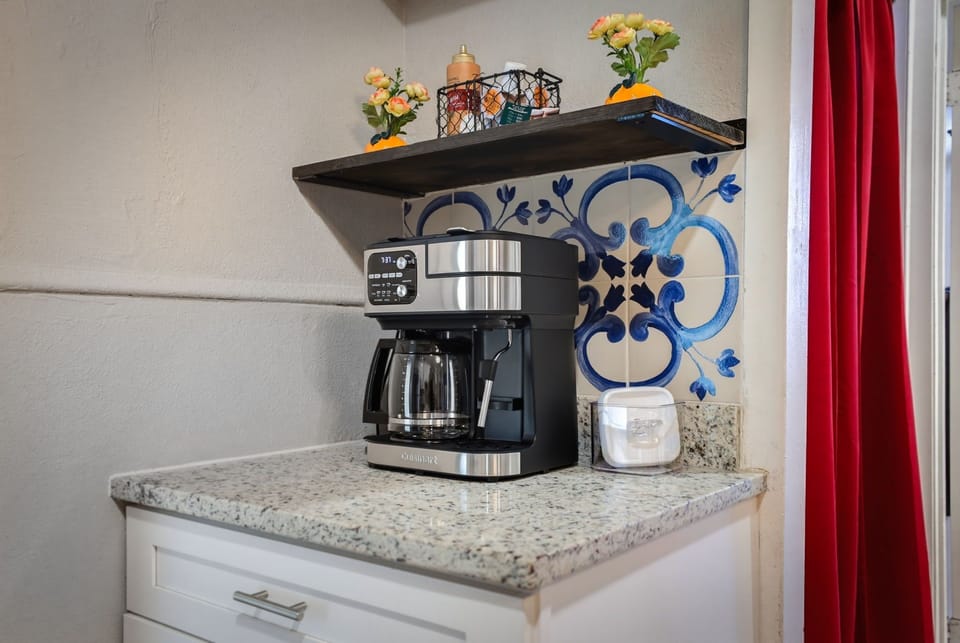 Charming coffee nook with granite counter and stylish decorative accents