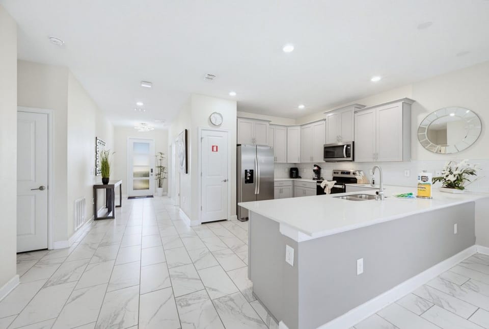 Full kitchen with stainless steel appliances