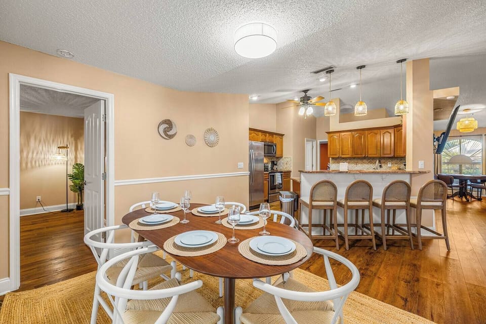 Round dining table for six, ideal for meals and conversation.