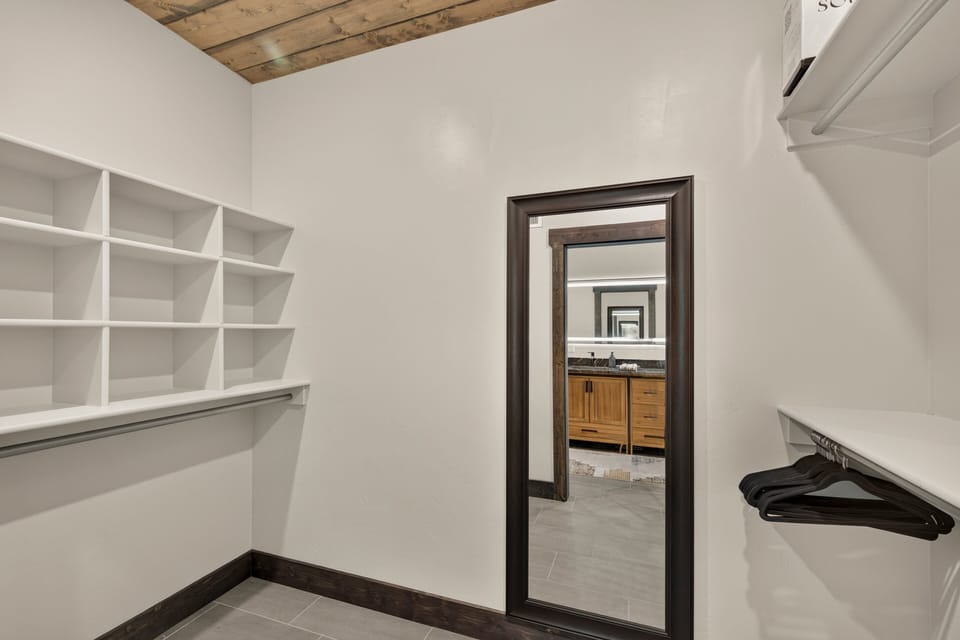 Fall River Lodge ~ bedroom #1 on main level w/ king bed, hanging bed, and private ensuite bath