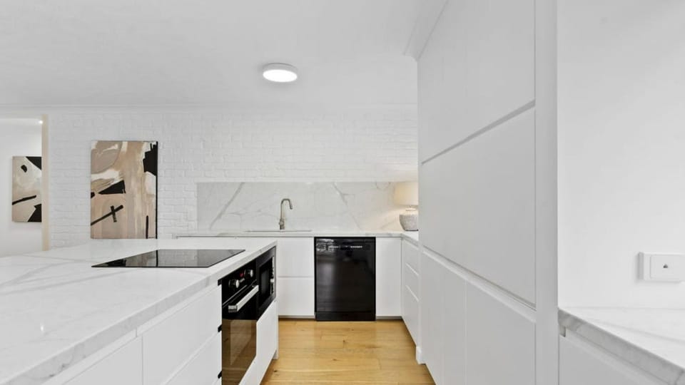 Cook with ease in the sleek contemporary kitchen, designed for both convenience and comfort.