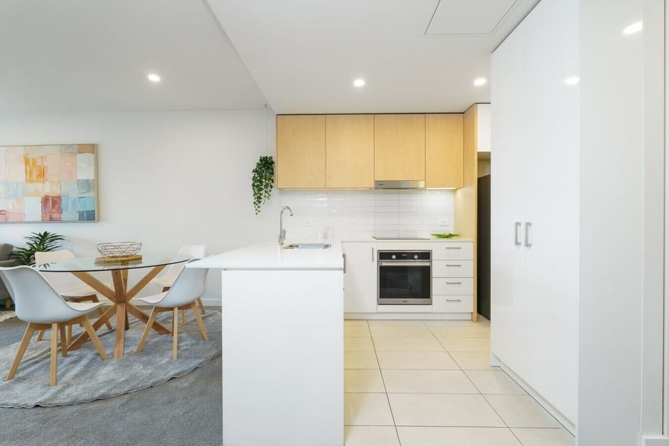 The functional kitchen connects seamlessly with the living and dining areas, making entertaining and everyday living effortless.