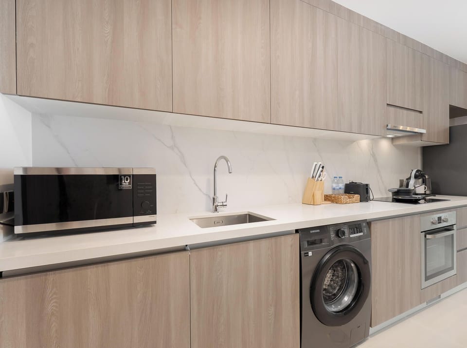 Deluxe Studio, Balcony, City View | Private kitchen | Coffee/tea maker, electric kettle, highchair