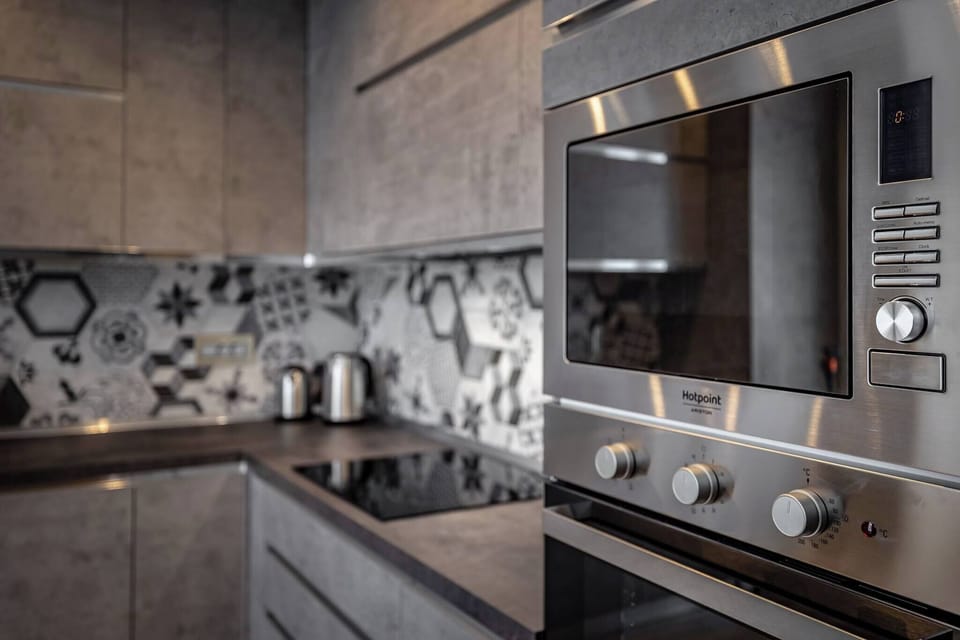 Apartment, 4 Bedrooms, 2 Bathrooms | Private kitchen | Coffee/tea maker, full-size fridge, microwave, stovetop