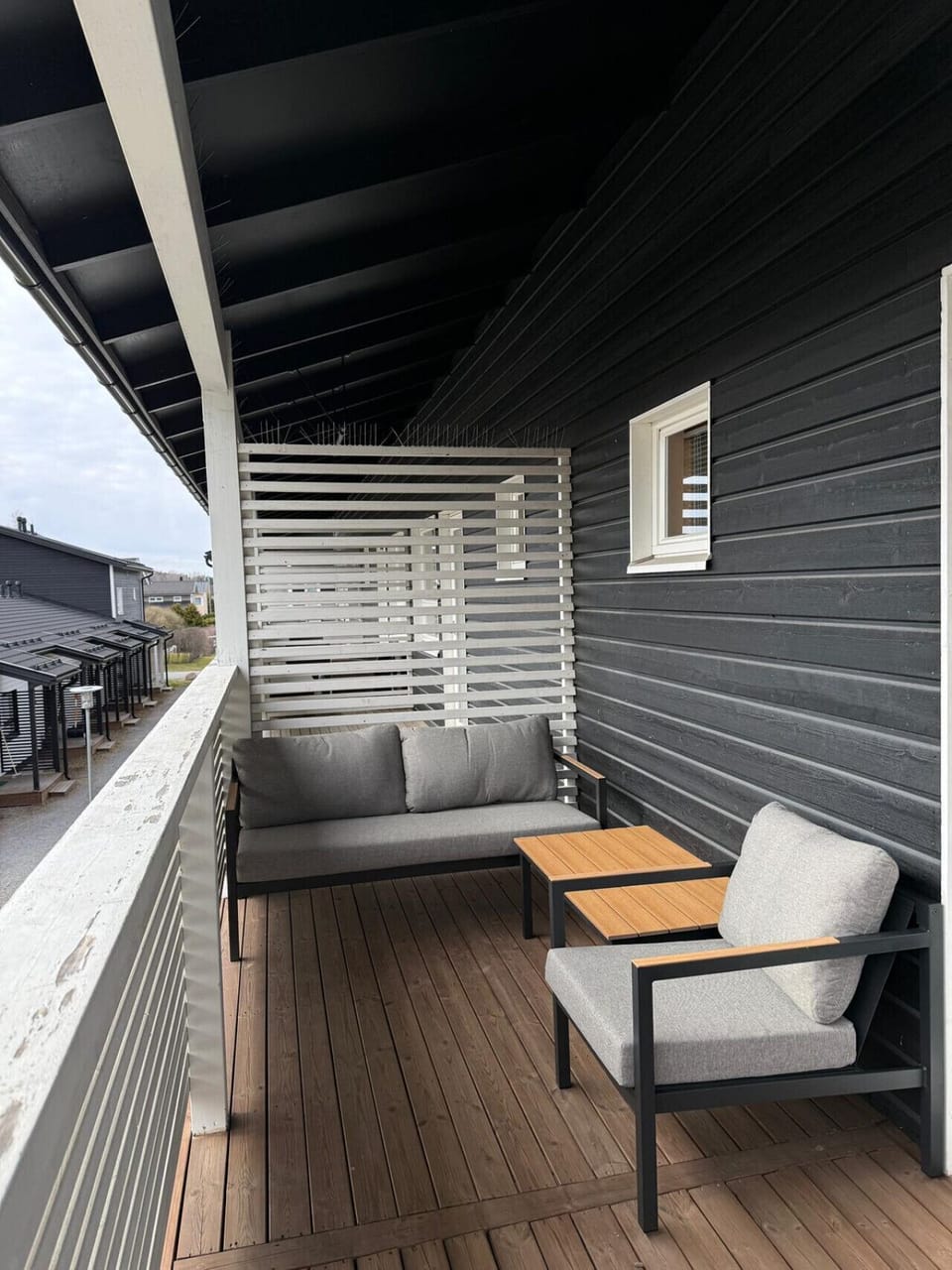 Balcony has lounge set and coffee table.