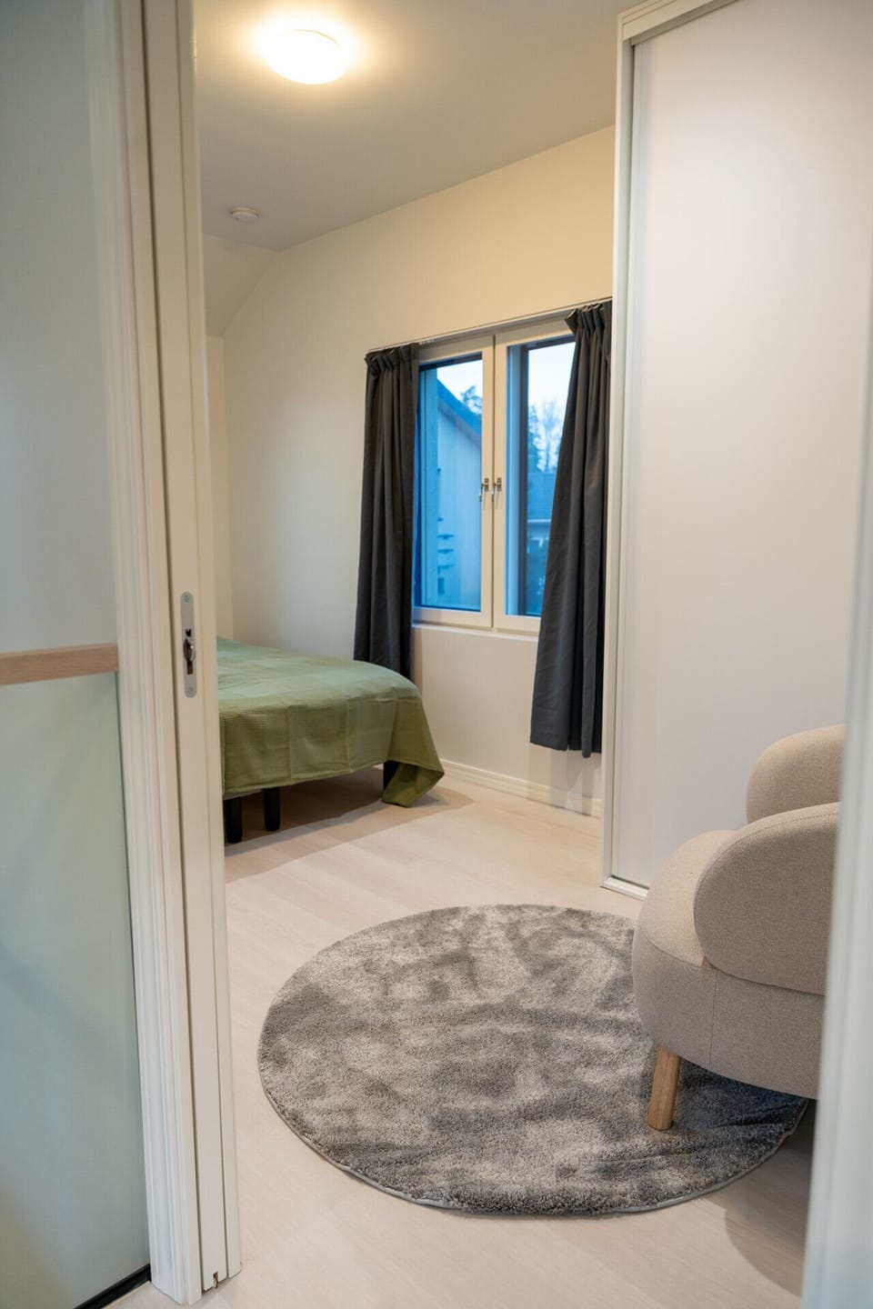 2nd bedroom has comfy 160cm wide double bed, arm chair and blackout curtains.
