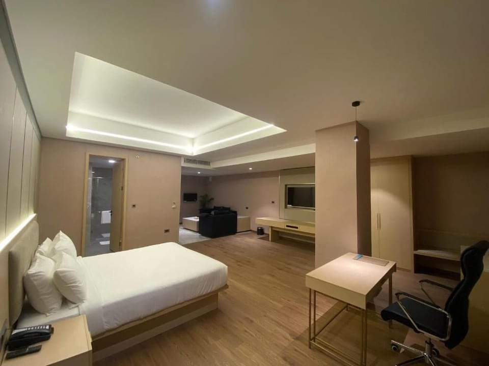Luxury Suite, City View | In-room safe, desk, laptop workspace, blackout drapes