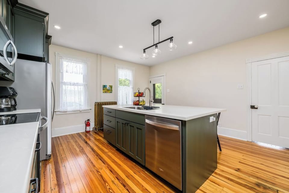 Fully equipped kitchen with service for 12. Exterior door with access to porch.