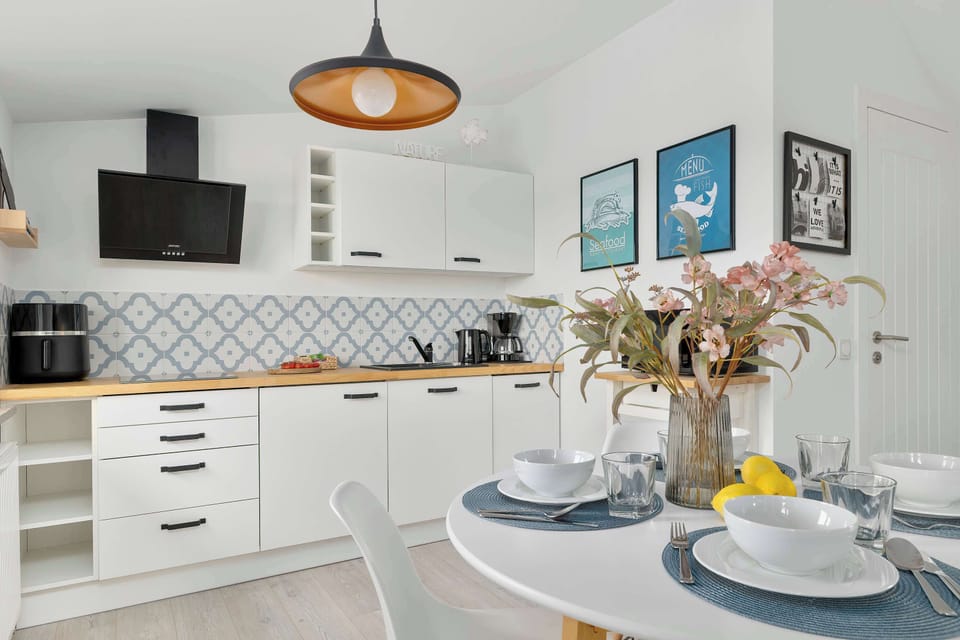 Modern kitchenette with everything needed to prepare meals, seamlessly connected to the living area.