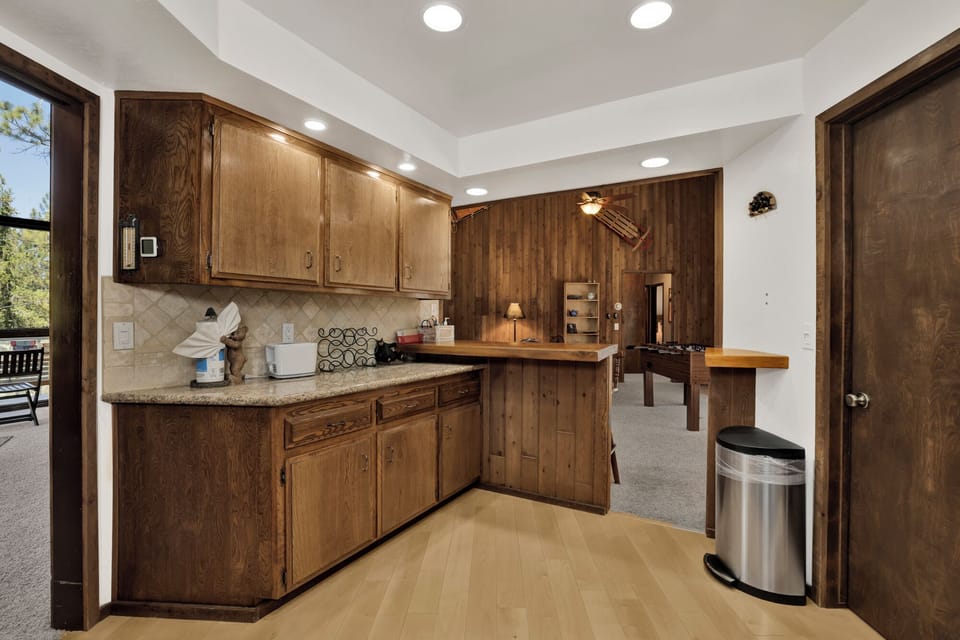 Fully equipped cabin kitchen with ample cabinetry, stove, fridge, and coffee maker—perfect for cooking meals, morning coffee, and feeling right at home on your stay.