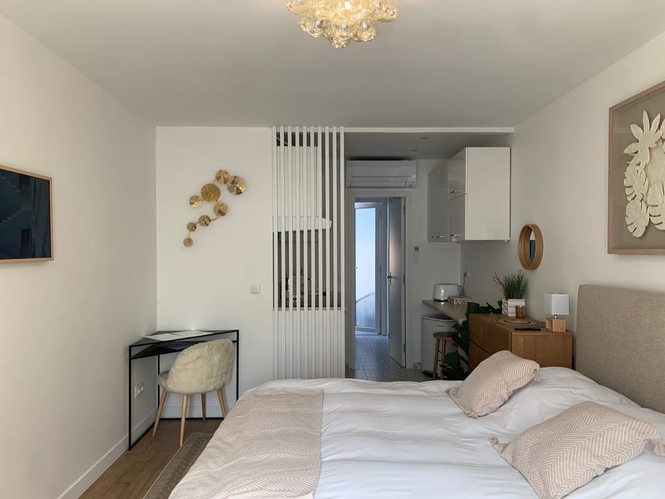 Deluxe Studio | Premium bedding, desk, blackout drapes, iron/ironing board