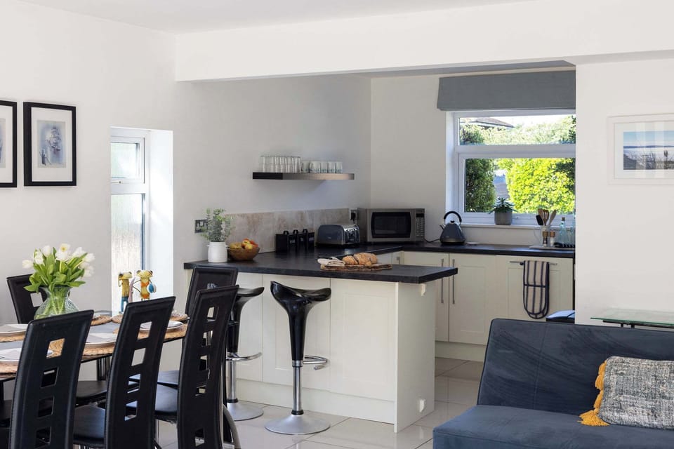 Prepare delicious meals in the modern, open plan kitchen of this relaxing holiday home.