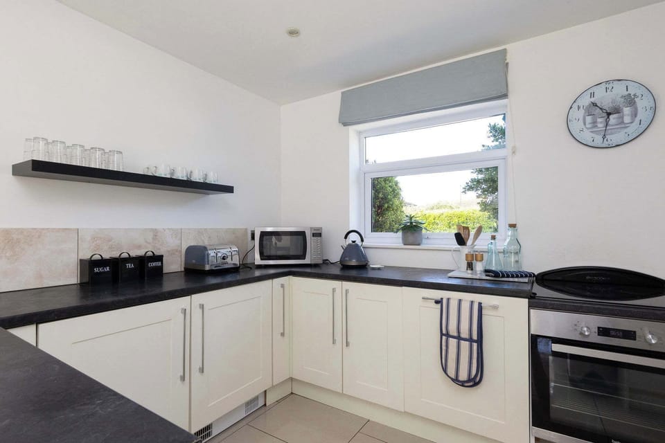 Prepare delicious meals in the fully equipped, modern kitchen of your beautiful holiday home.