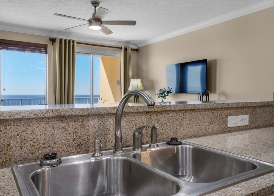 Cook with breathtaking ocean views as your backdrop—this kitchen seamlessly blends function and coastal beauty, inviting you to prepare meals while soaking in the serene sea horizon.