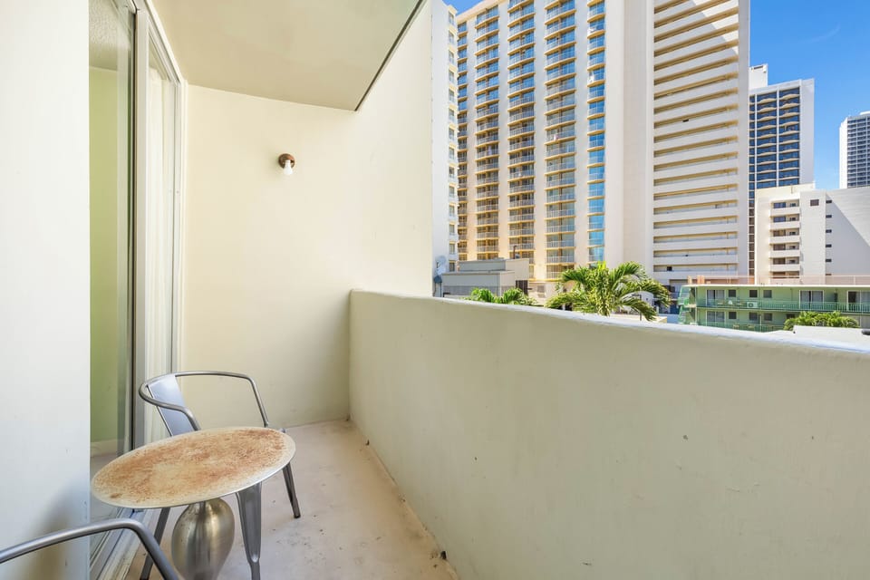Step onto your private balcony where city views and fresh air await. Enjoy morning coffee at the bistro table while soaking in the urban landscape and vibrant skyline around you.