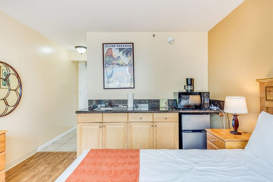 Your suite features a convenient kitchenette with granite countertops, mini-fridge, microwave, and coffee maker—perfect for preparing quick snacks or morning coffee before exploring the island.