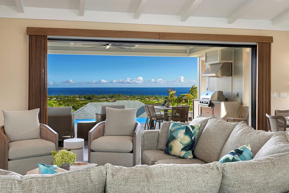 Folding glass disappears and the great room becomes part of the view to the water.
