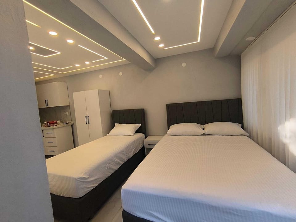 Luxury Room, Multiple Beds, Balcony, Garden View | Desk, laptop workspace