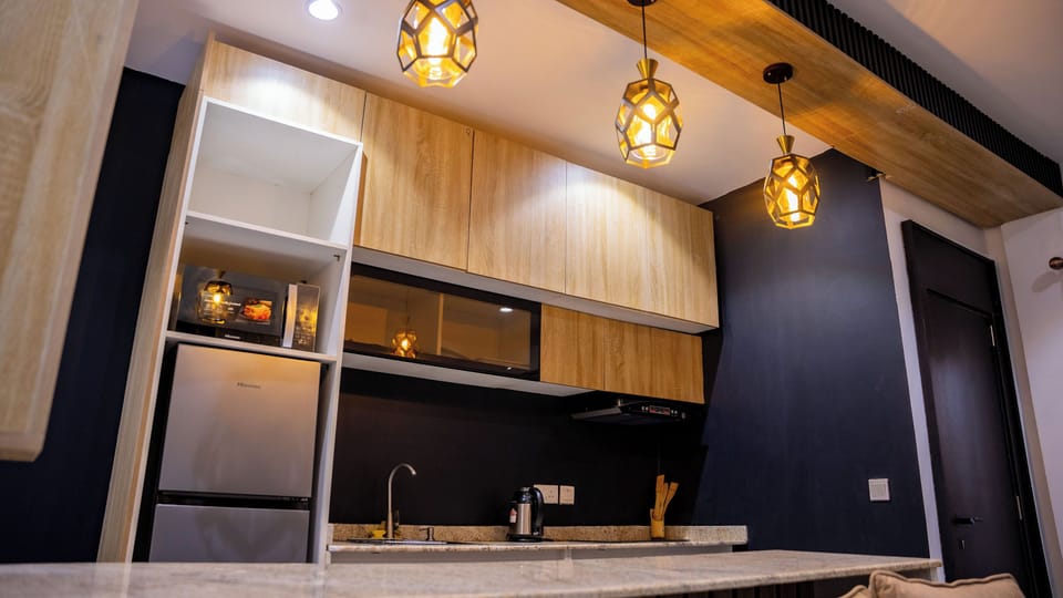 One-Bedroom King Size Apartment | Private kitchen | Fridge, microwave, cookware/dishes/utensils