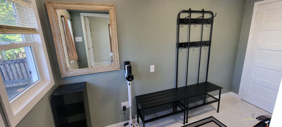 Mudroom has plenty of space for shoes and jackets