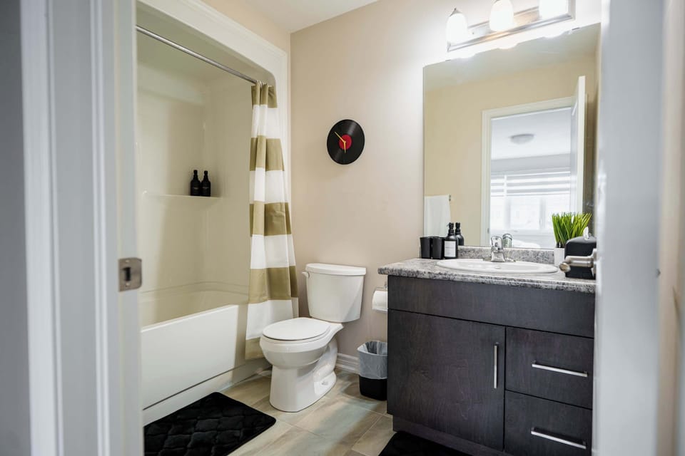 Begin and end each day in a comfortable private bathroom with the flexibility of a full tub and shower. The practical layout makes getting ready, freshening up, or enjoying a relaxing soak feel effortless.