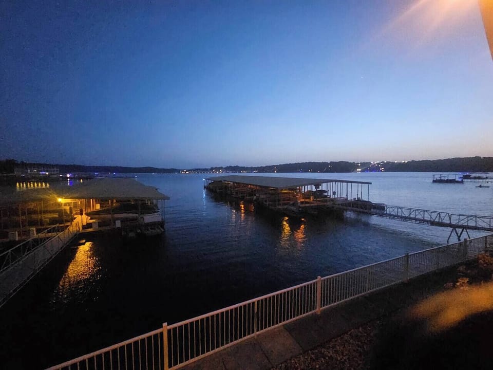 As evening settles in, watch the lights reflect across the lake from your front-row view.