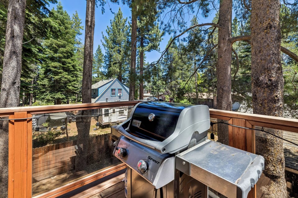 Picture yourself grilling up a feast on your private deck, surrounded by towering pines and fresh mountain air—a perfect spot for outdoor meals with a view.