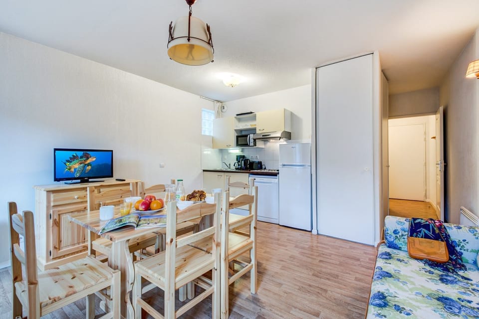 Prepare meals in the kitchenette and enjoy them at the dining table.