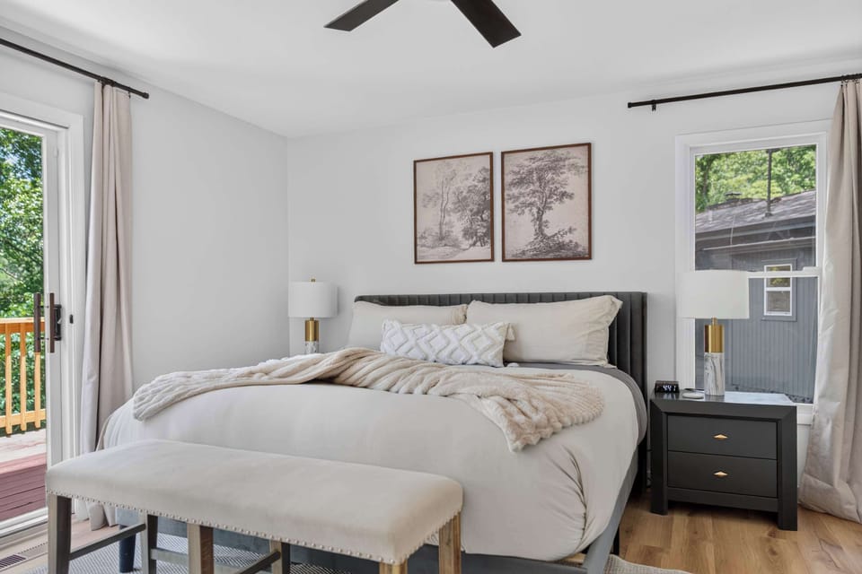 Restful king bedroom with soft linens and bedside tables