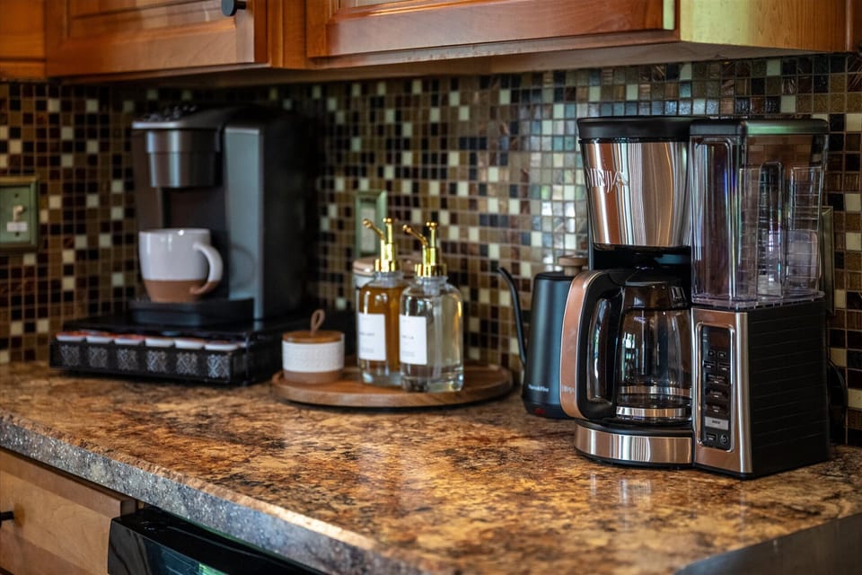 Coffee bar with Ninja drip, Keurig, ground coffee, and pods provided.